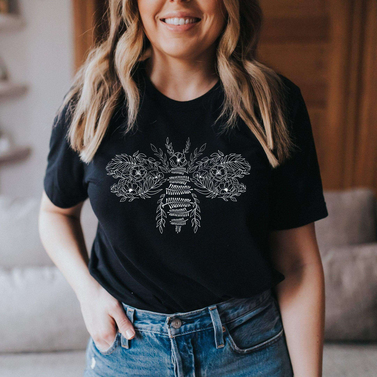 Flower Bee T-Shirt by Winks Design Studio, LLC featuring a colorful flower and bee graphic on a casual T-shirt.