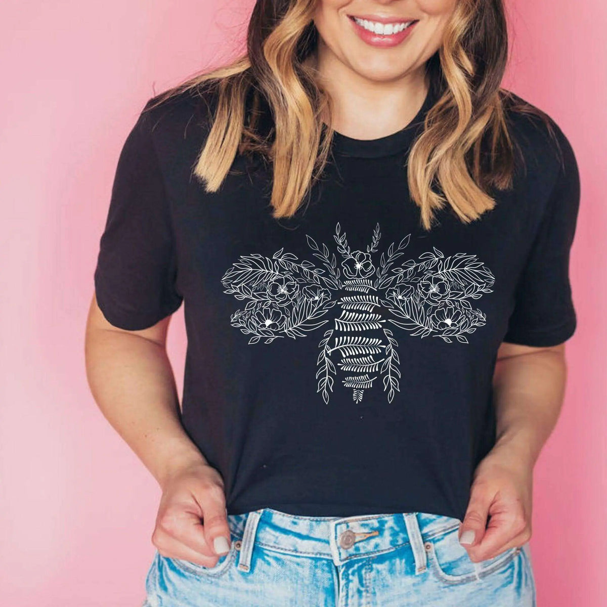 Flower Bee T-Shirt by Winks Design Studio, LLC featuring a colorful flower and bee graphic on a casual T-shirt.