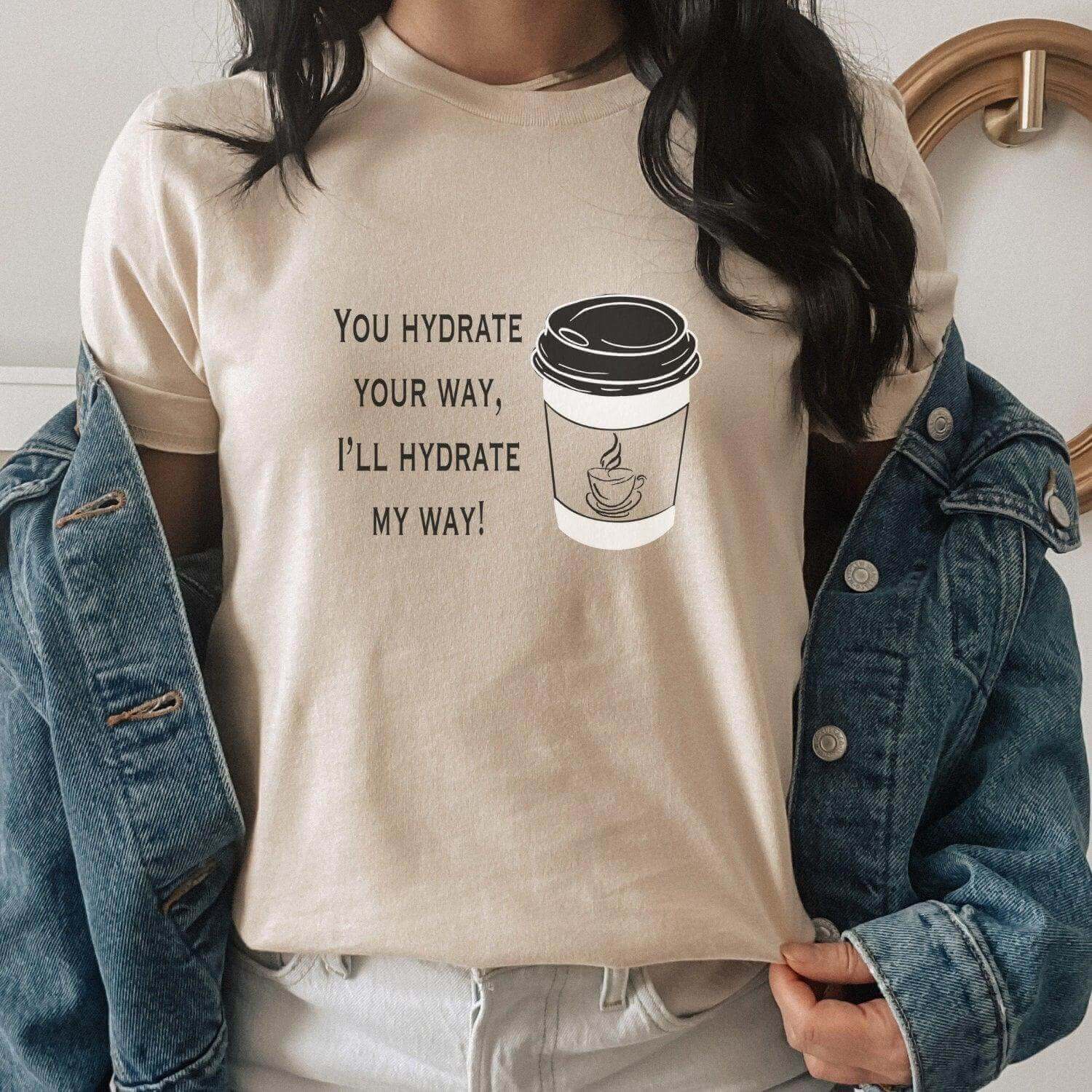 Funny coffee T-shirt from Winks Design Studio featuring a humorous "You Hydrate Your Way" design on a casual T-shirt.