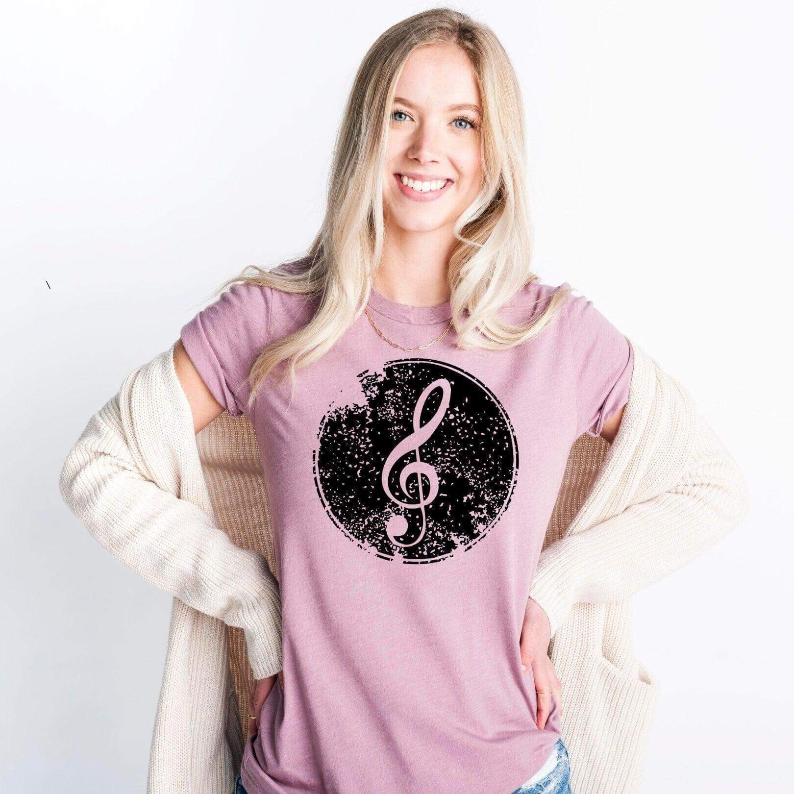 Heather orchid short sleeve T-shirt featuring a black treble clef musical symbol design from Winks Design Studio, LLC.