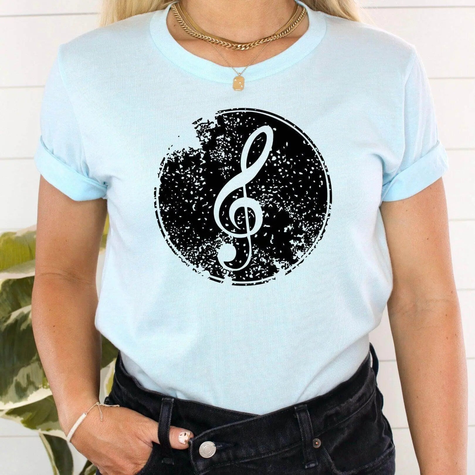 Heather orchid short sleeve T-shirt with a treble clef musical symbol print by Winks Design Studio, LLC.