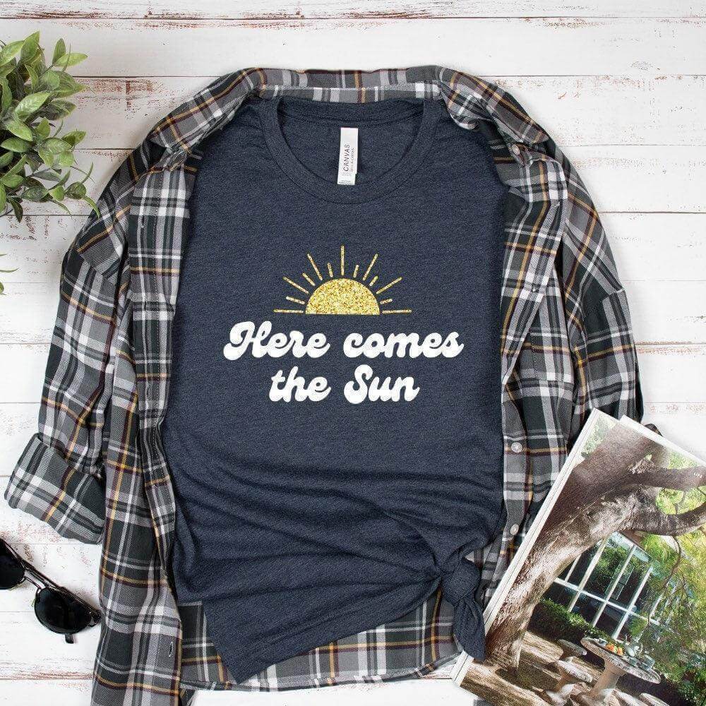 Winks Design Studio LLC Here Comes The Sun T-shirt, casual cotton tee with sun graphic, in small size.
