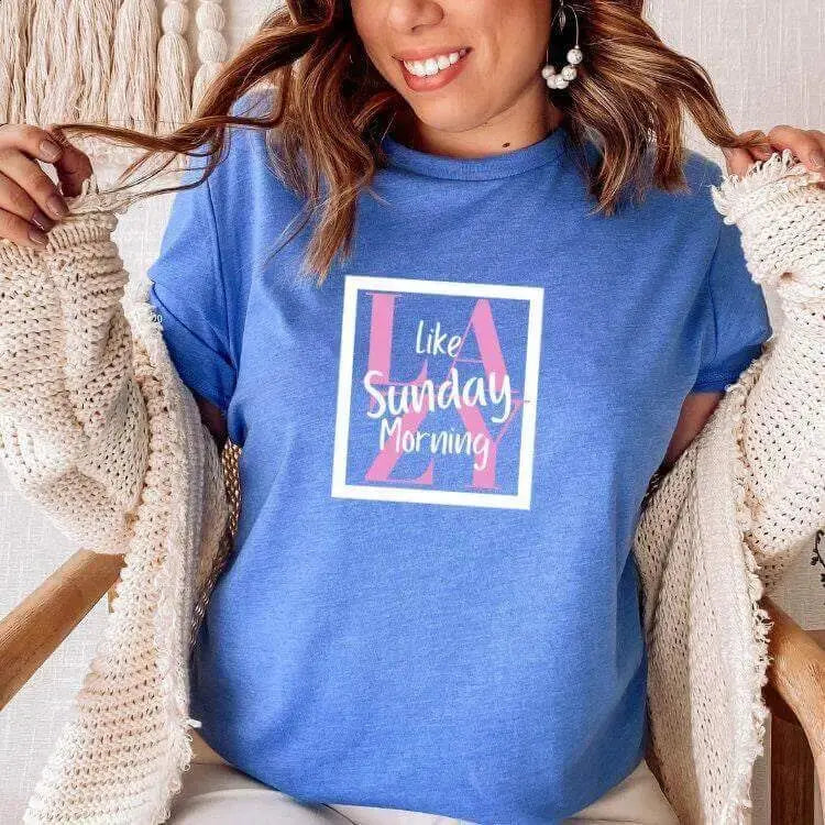 Winks Design Studio LLC Lazy Like Sunday Morning T-shirt in soft fabric with relaxed fit and casual style, displayed on a hanger.