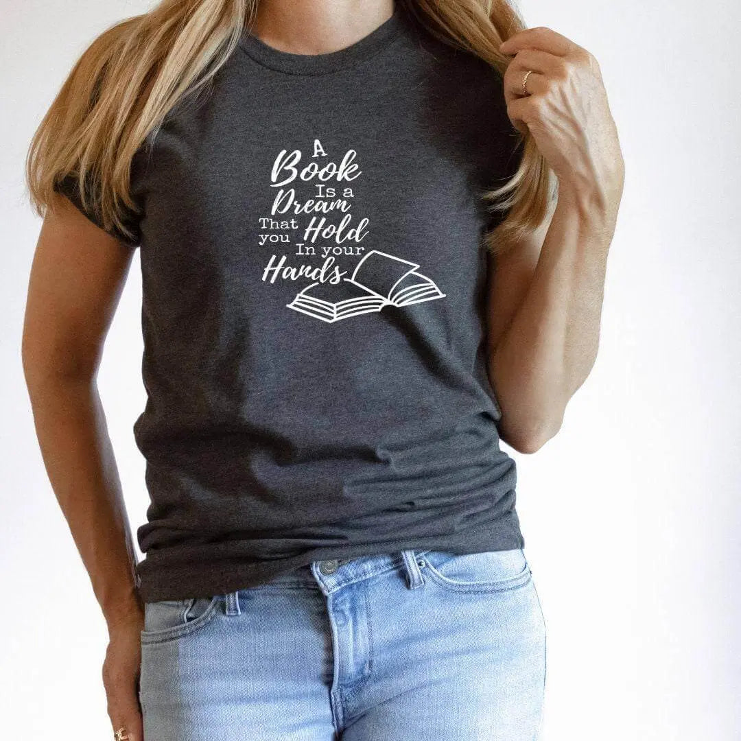 Mauve t-shirt by Winks Design Studio LLC featuring a design with the phrase "A Book Is A Dream That You Hold In Your Hands."