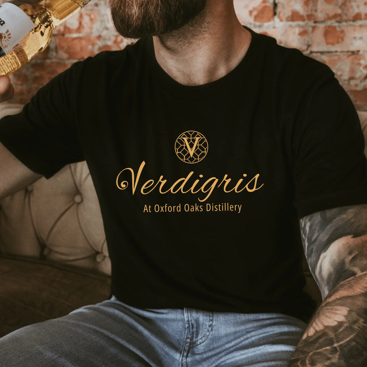 Navy blue Verdigris T-shirt by Winks Design Studio, LLC, featuring a small design on the chest area.