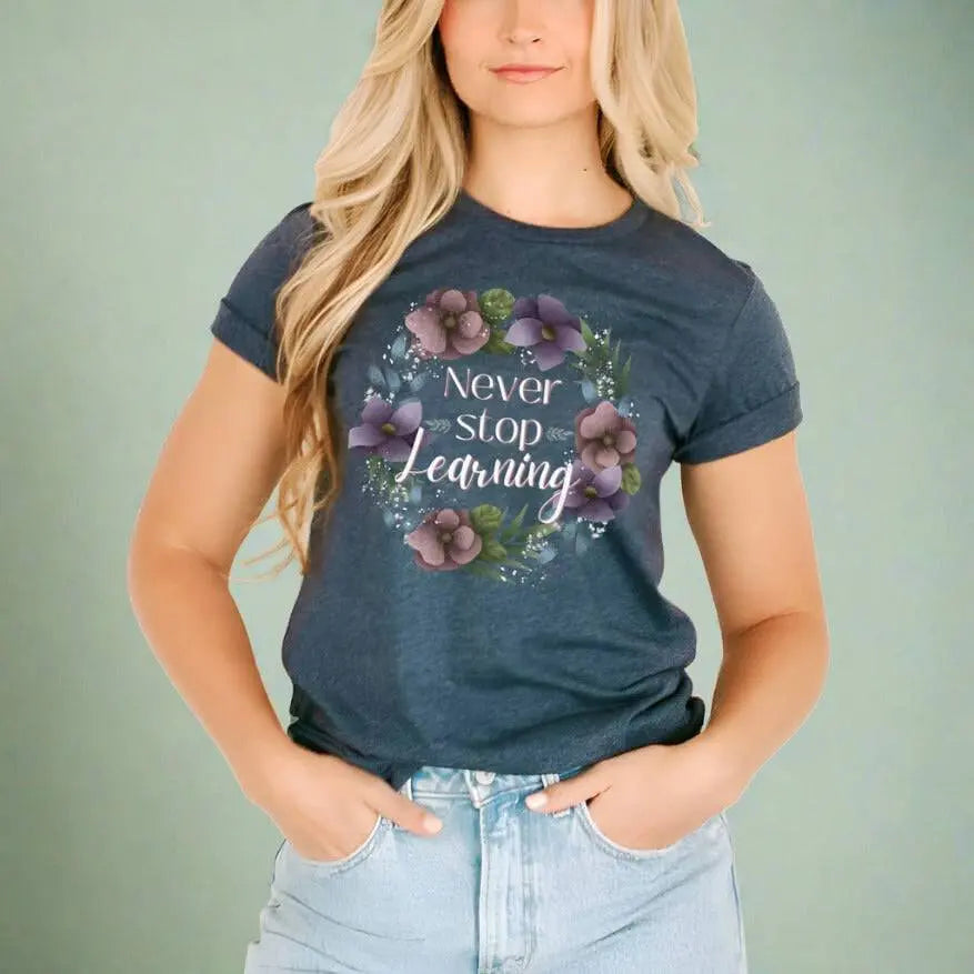 Winks Design Studio LLC Never Stop Learning T-shirt in small size, featuring a motivational design on cotton fabric.
