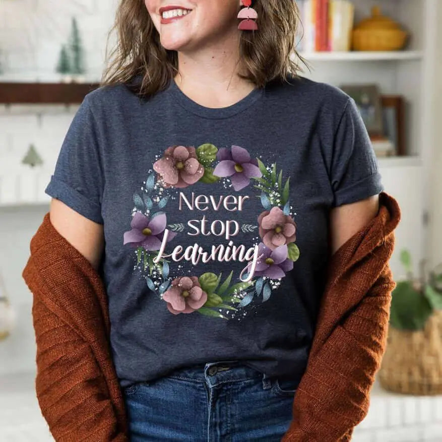 Winks Design Studio LLC Never Stop Learning T-shirt in small size, featuring bold text and casual fit for everyday wear.