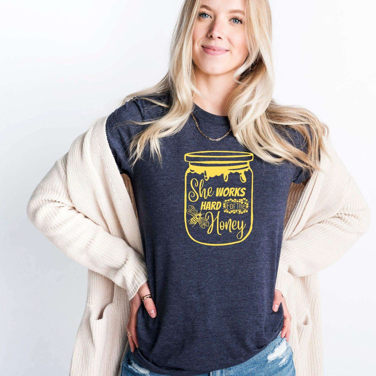 Winks Design Studio LLC She Works Hard For The Honey T-shirt, casual black cotton tee with printed slogan, front view.
