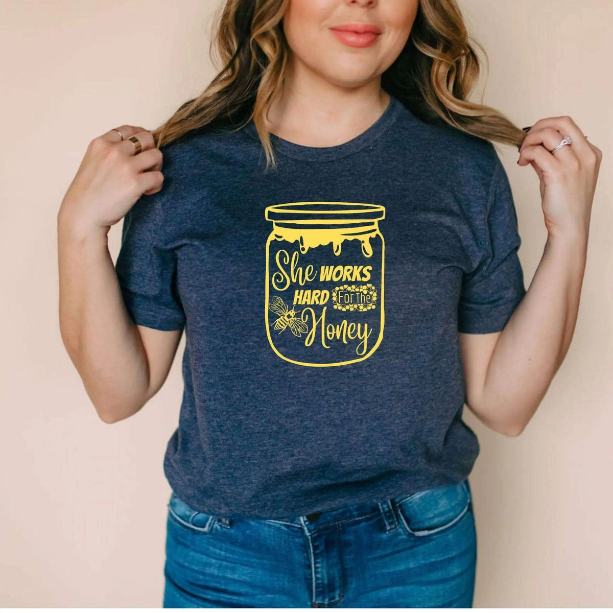 Winks Design Studio LLC She Works Hard For The Honey T-shirt, black cotton tee with printed slogan, casual and comfortable.
