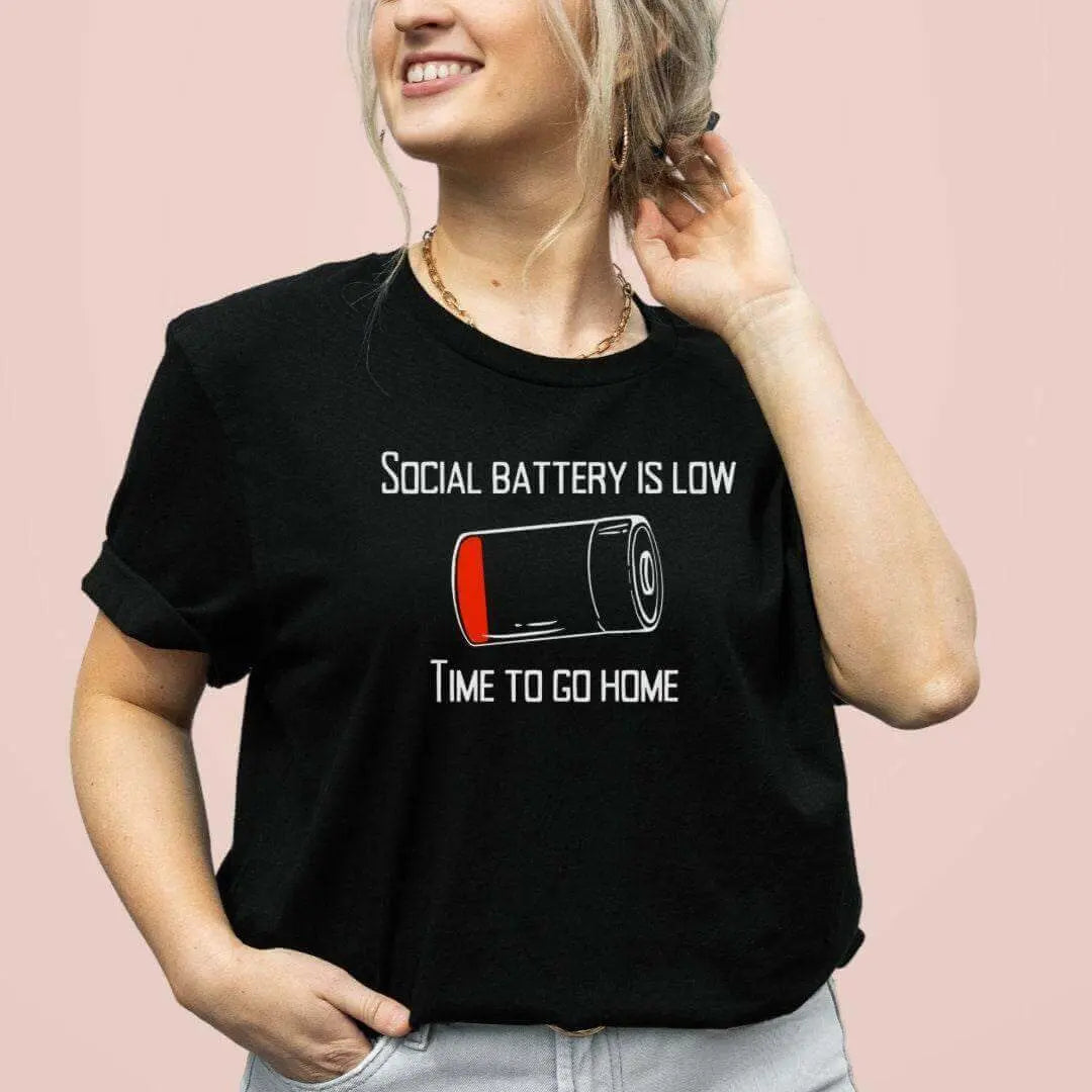 Winks Design Studio LLC Social Battery Is Low T-shirt featuring a graphic design with a low battery icon on a casual black T-shirt.