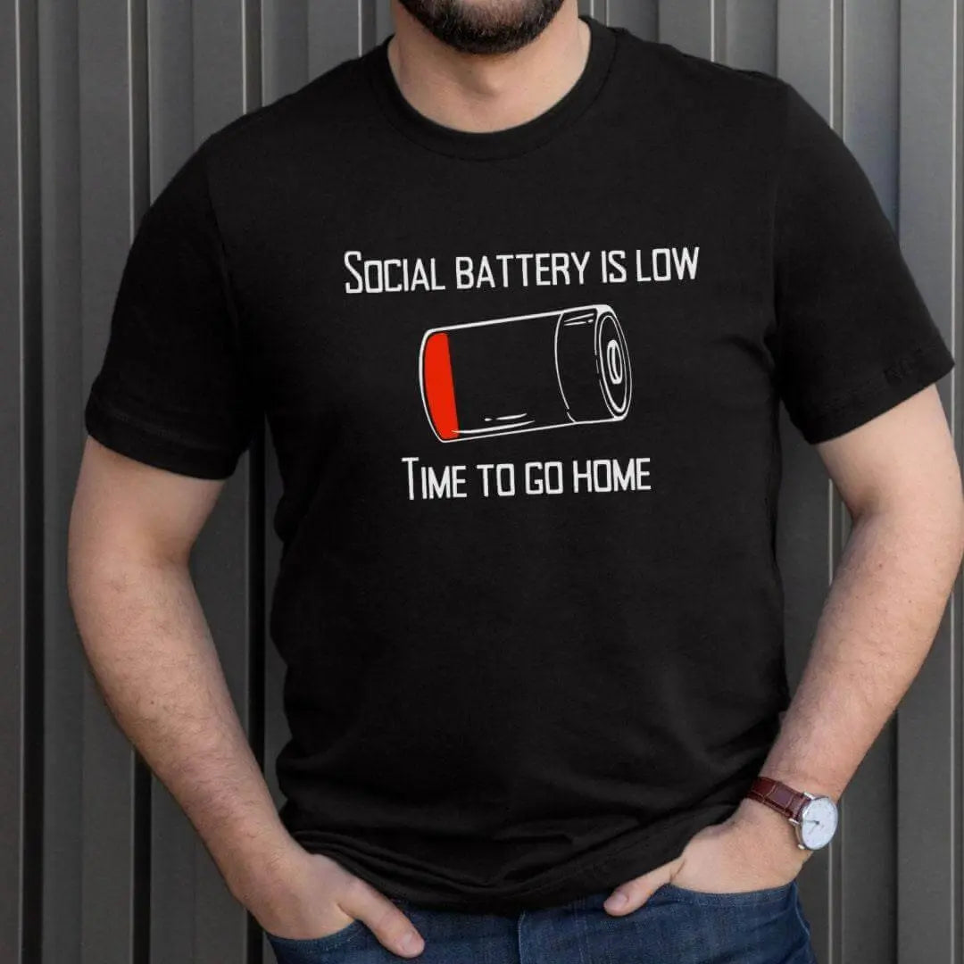 Winks Design Studio LLC Social Battery Is Low T-shirt showing a humorous design with a low battery icon and text in casual style.