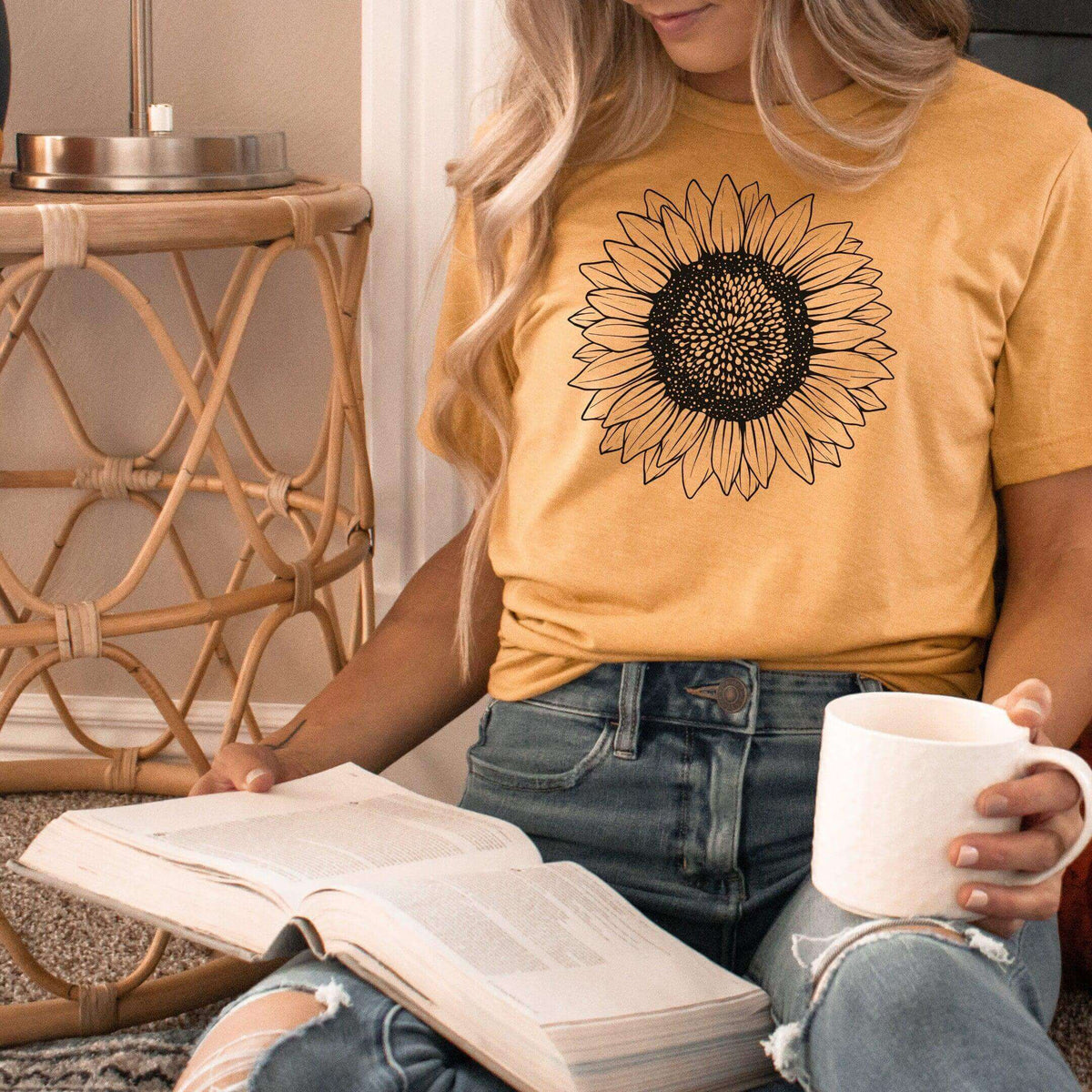 Small sunflower T-shirt by Winks Design Studio, LLC featuring a bright sunflower graphic on a casual shirt.