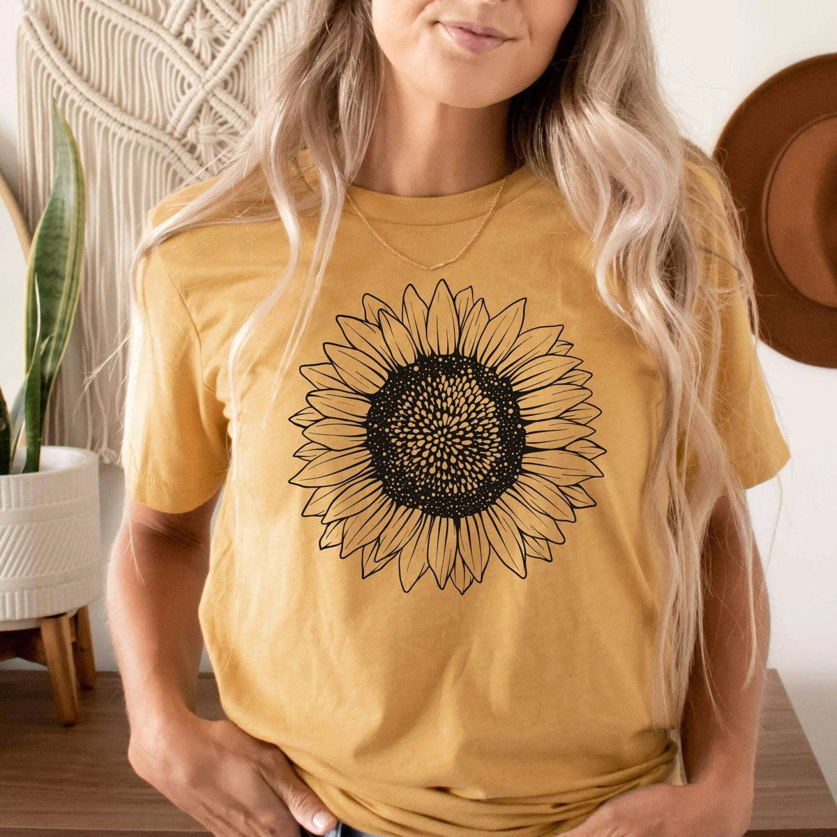 Small sunflower T-shirt by Winks Design Studio, LLC, featuring a colorful sunflower graphic on a casual cotton shirt.
