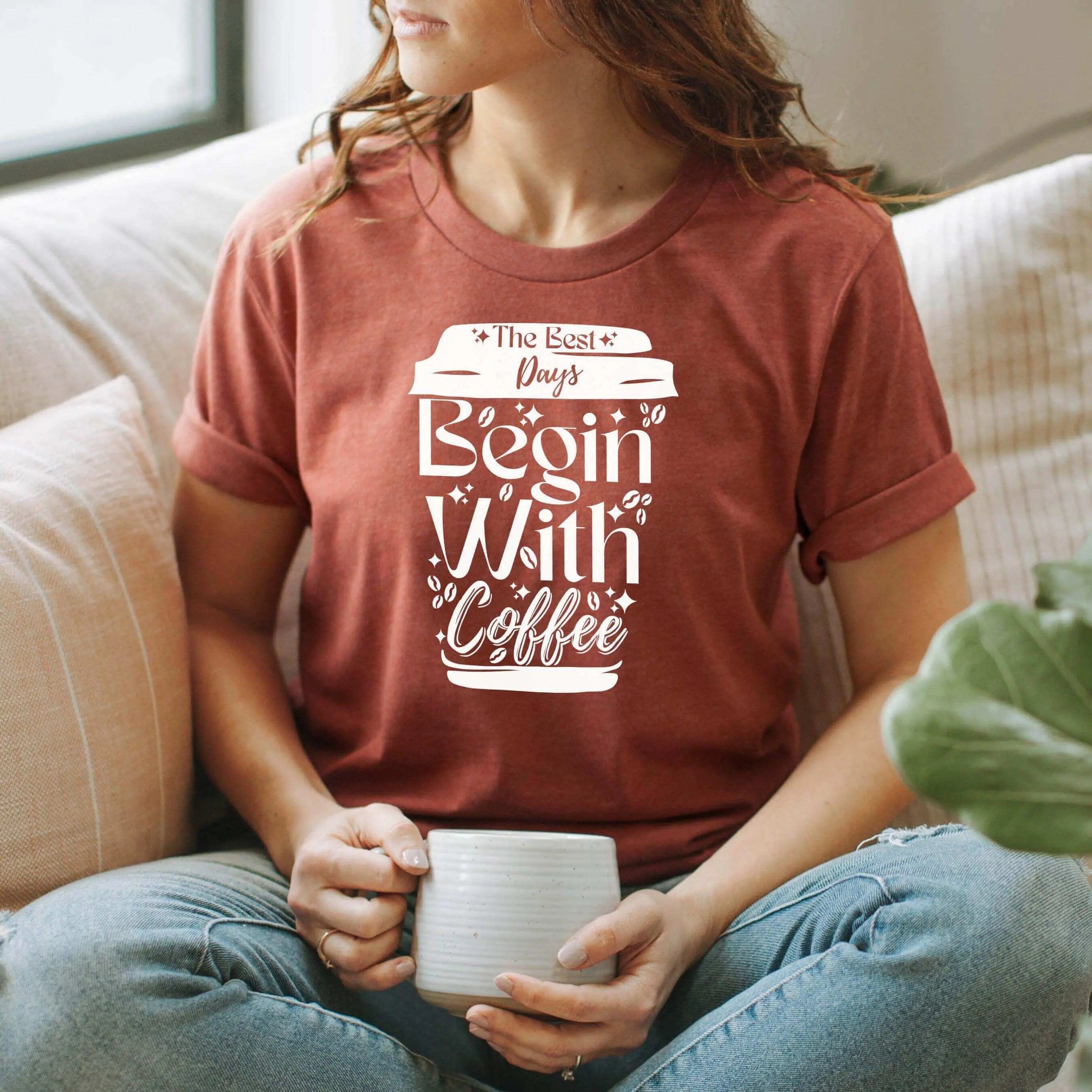 Winks Design Studio LLC graphic T-shirt featuring "The Best Days Begin With Coffee" text and coffee cup illustration.