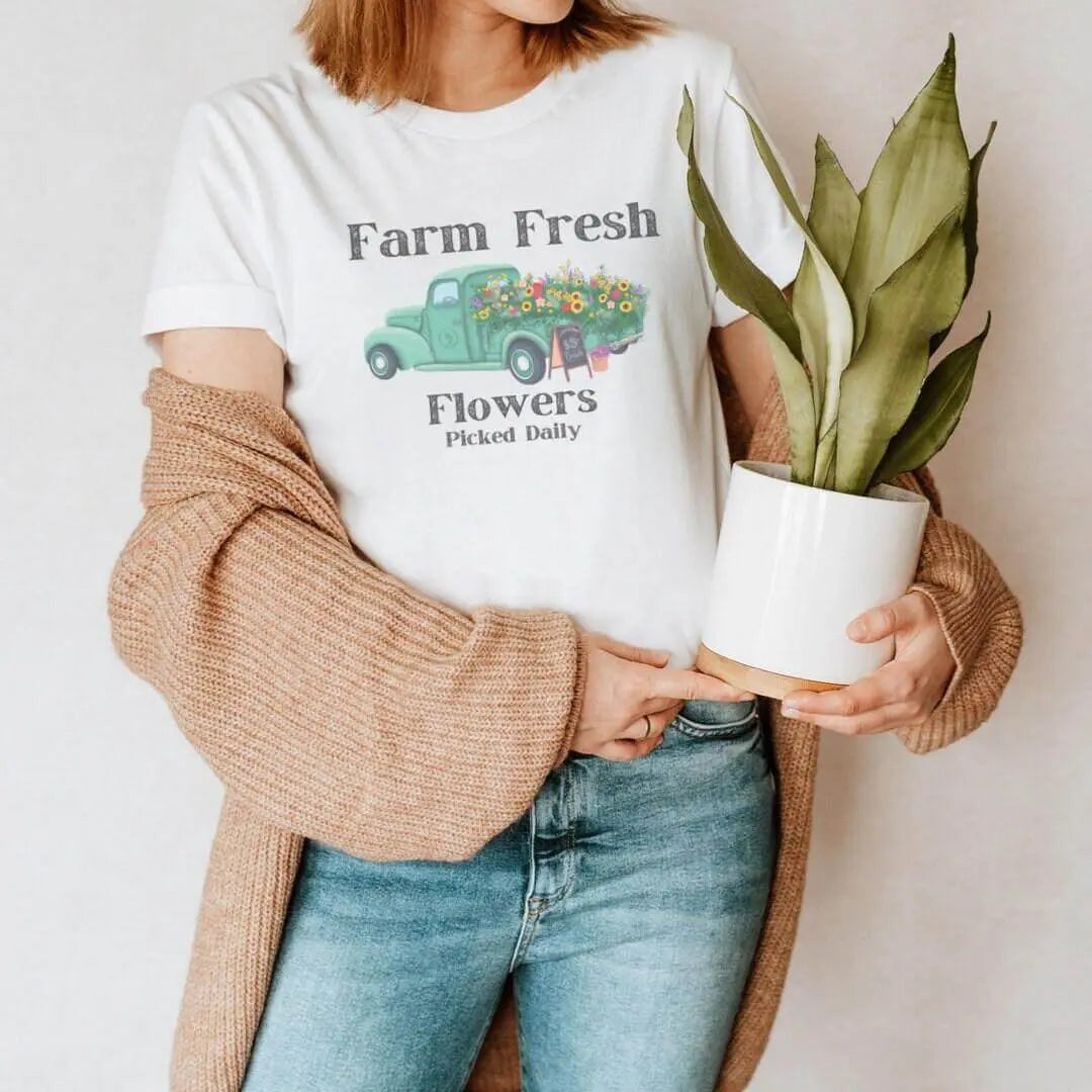 Vintage Flower Truck T-shirt by Winks Design Studio featuring a colorful floral truck graphic on a casual T-shirt.