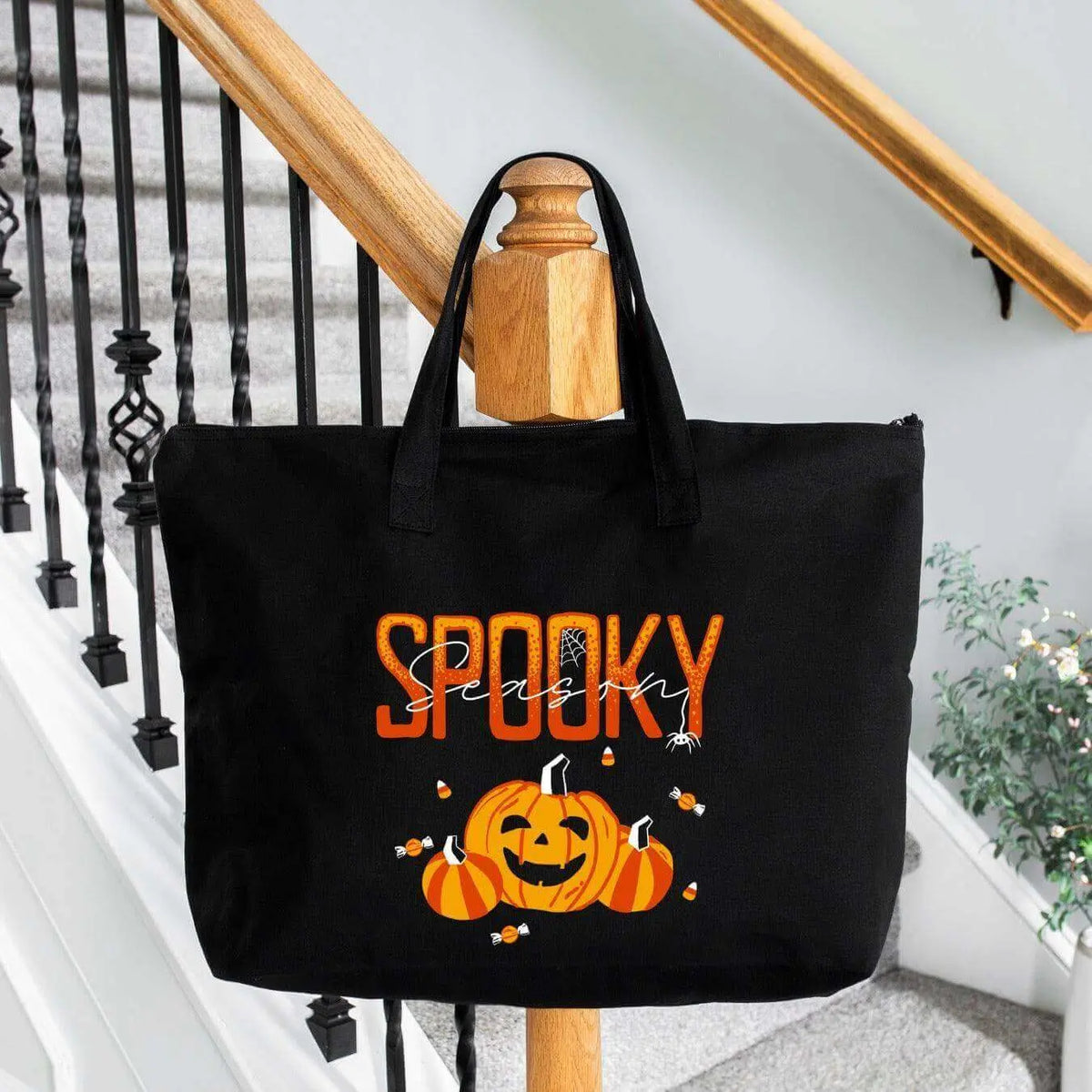 Spooky Season Canvas Tote Bag by Winks Design Studio LLC with Halloween-themed spooky design and sturdy handles.