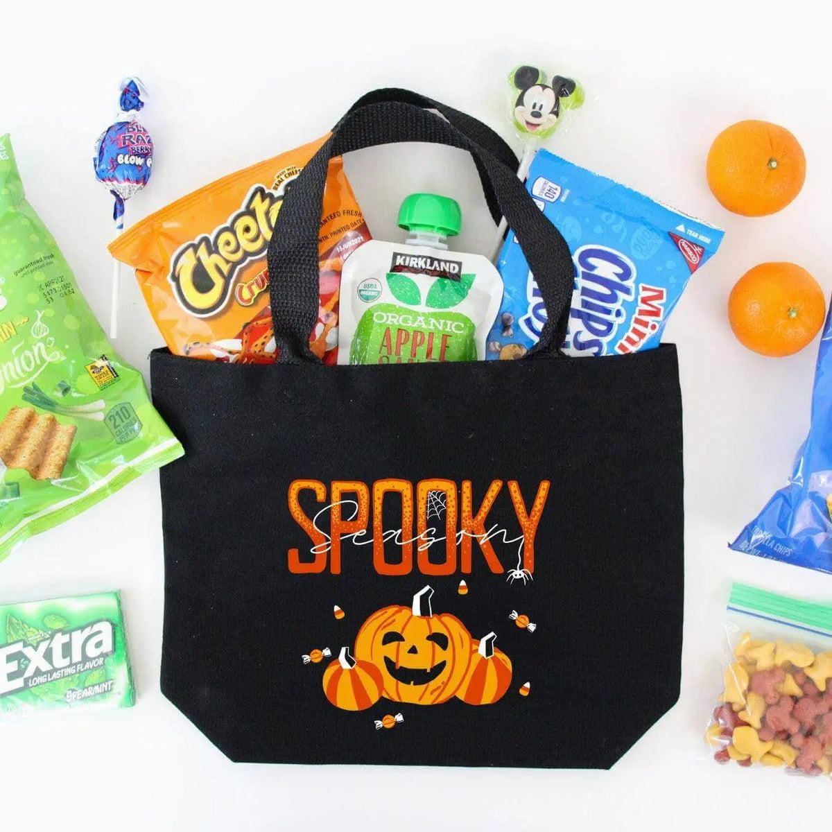 Spooky Season canvas tote bag by Winks Design Studio,LLC featuring Halloween-themed spooky design on durable fabric.