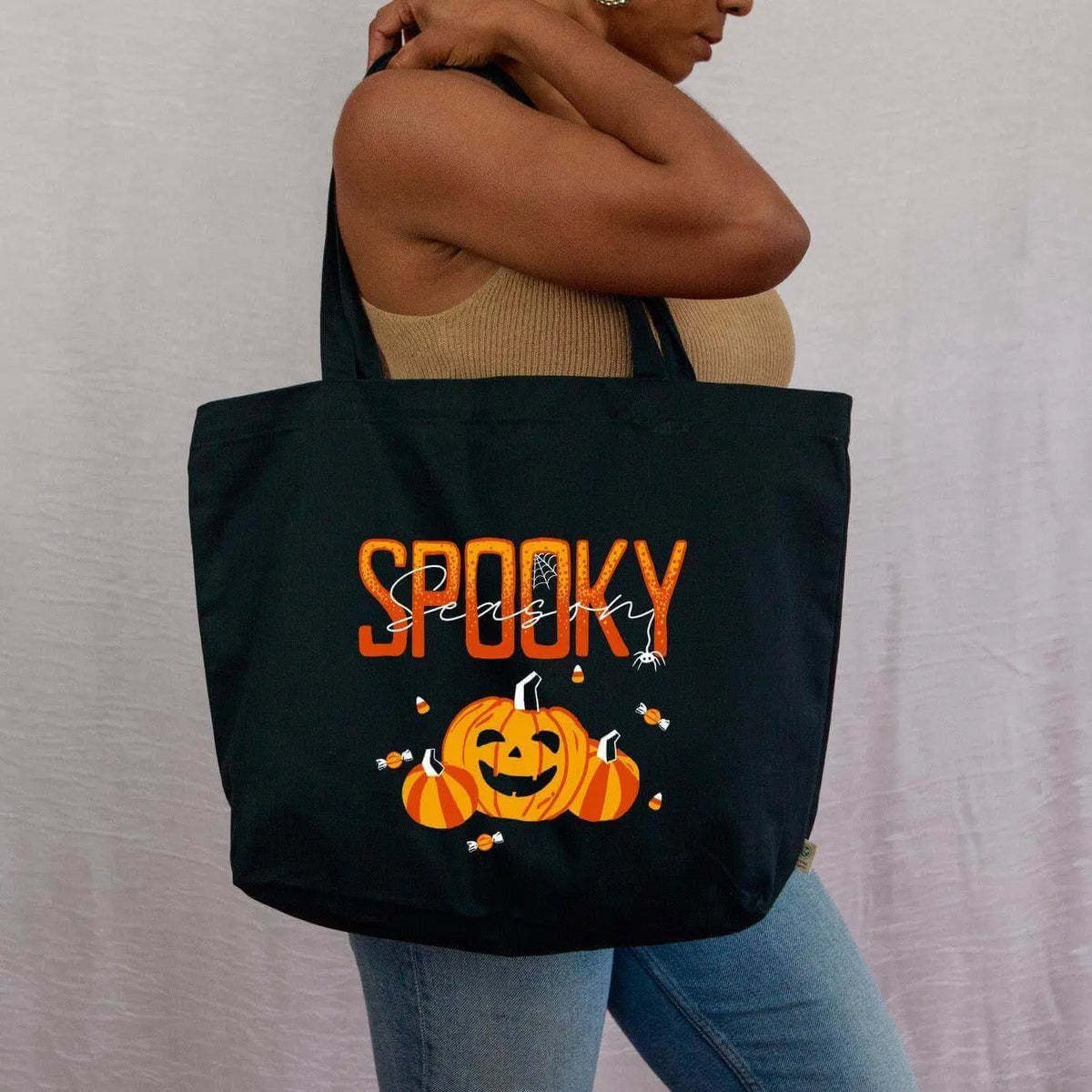 Spooky Season canvas tote bag by Winks Design Studio, LLC featuring Halloween-themed spooky season design and sturdy fabric.