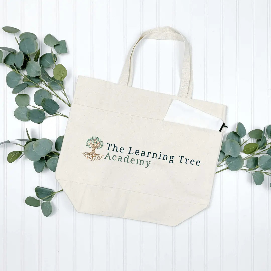 Winks Design Studio LLC tote bag featuring The Learning Tree Academy logo with colorful tree design on fabric.