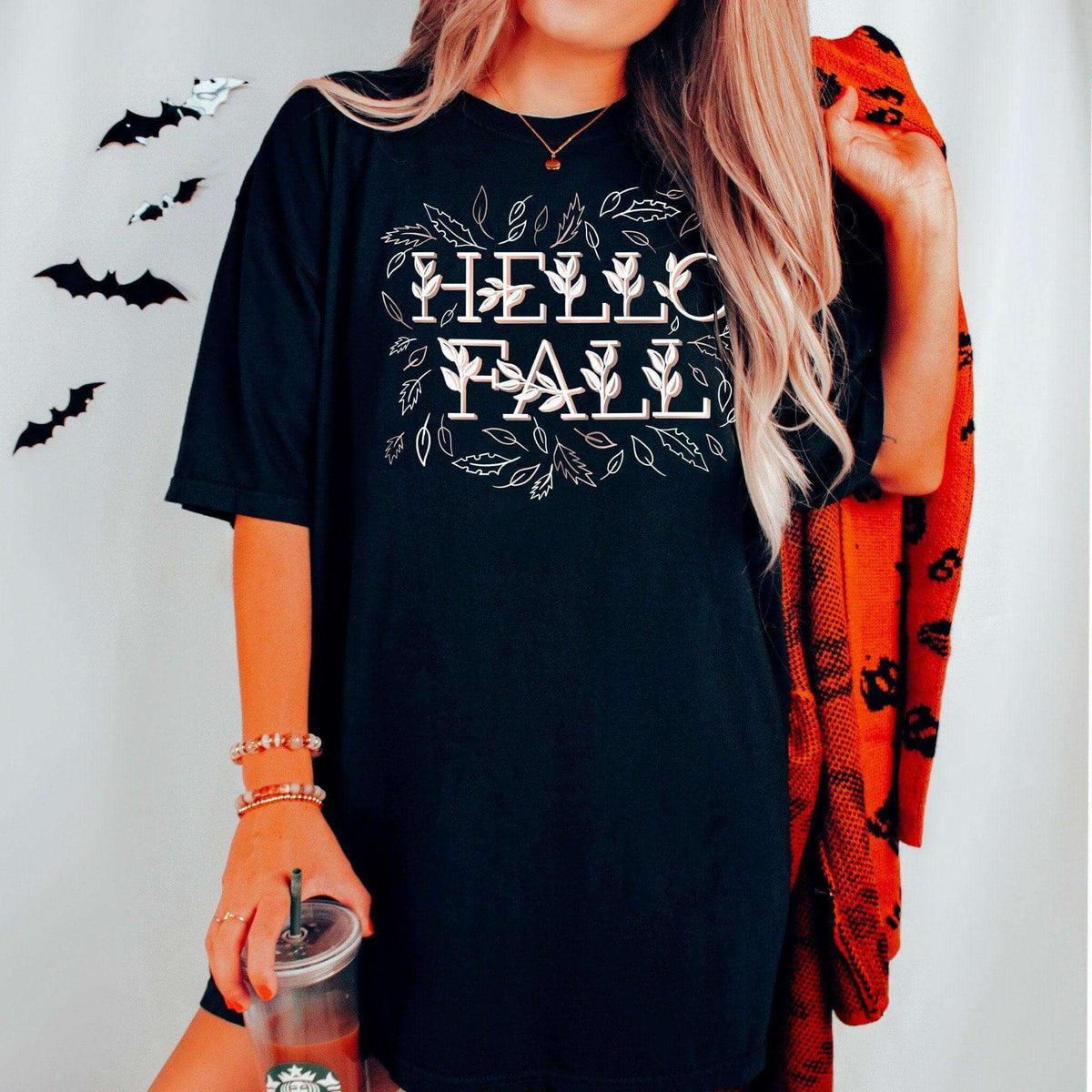 Winks Design Studio LLC Hello Fall short sleeve t-shirt with fall-themed graphic and casual fit on a plain background