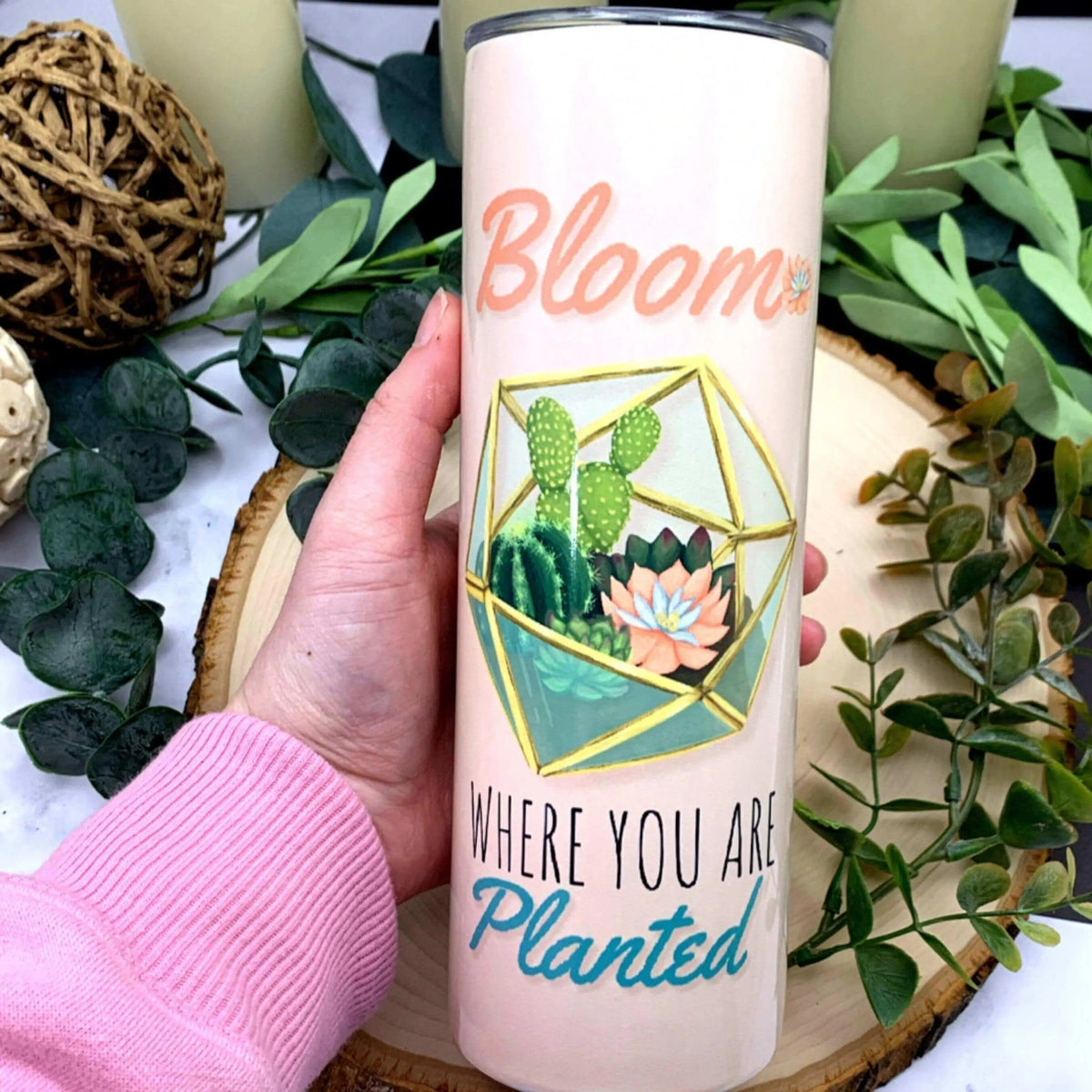 Winks Design Studio LLC peach terrarium insulated tumbler with lid and straw, featuring a decorative terrarium design on the surface.