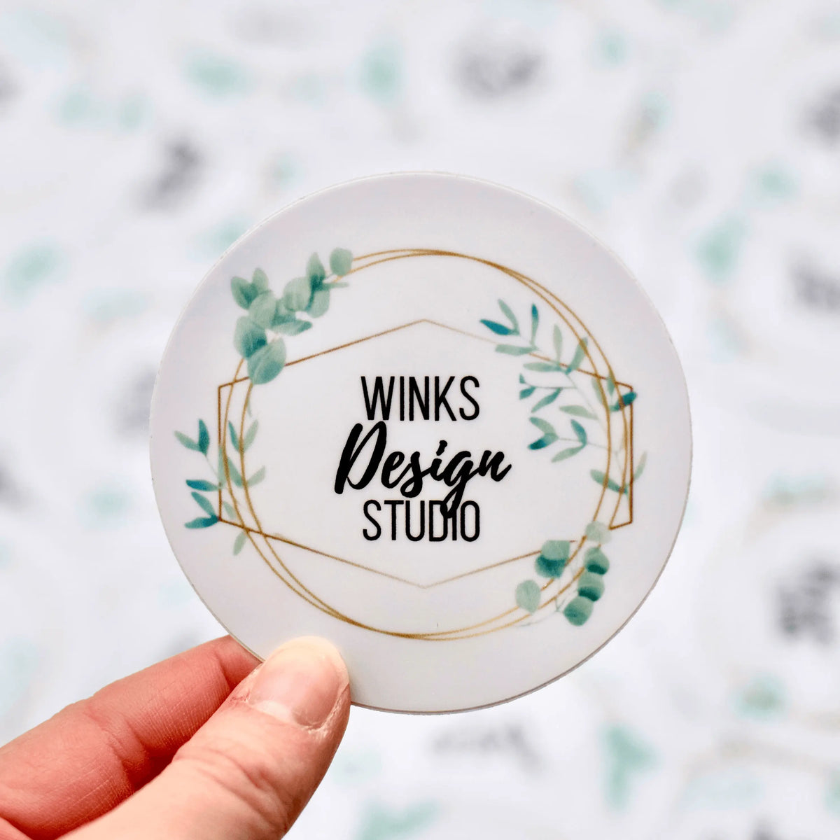 Circular Winks Design Studio vinyl sticker featuring colorful, artistic graphics in a bold, eye-catching design.