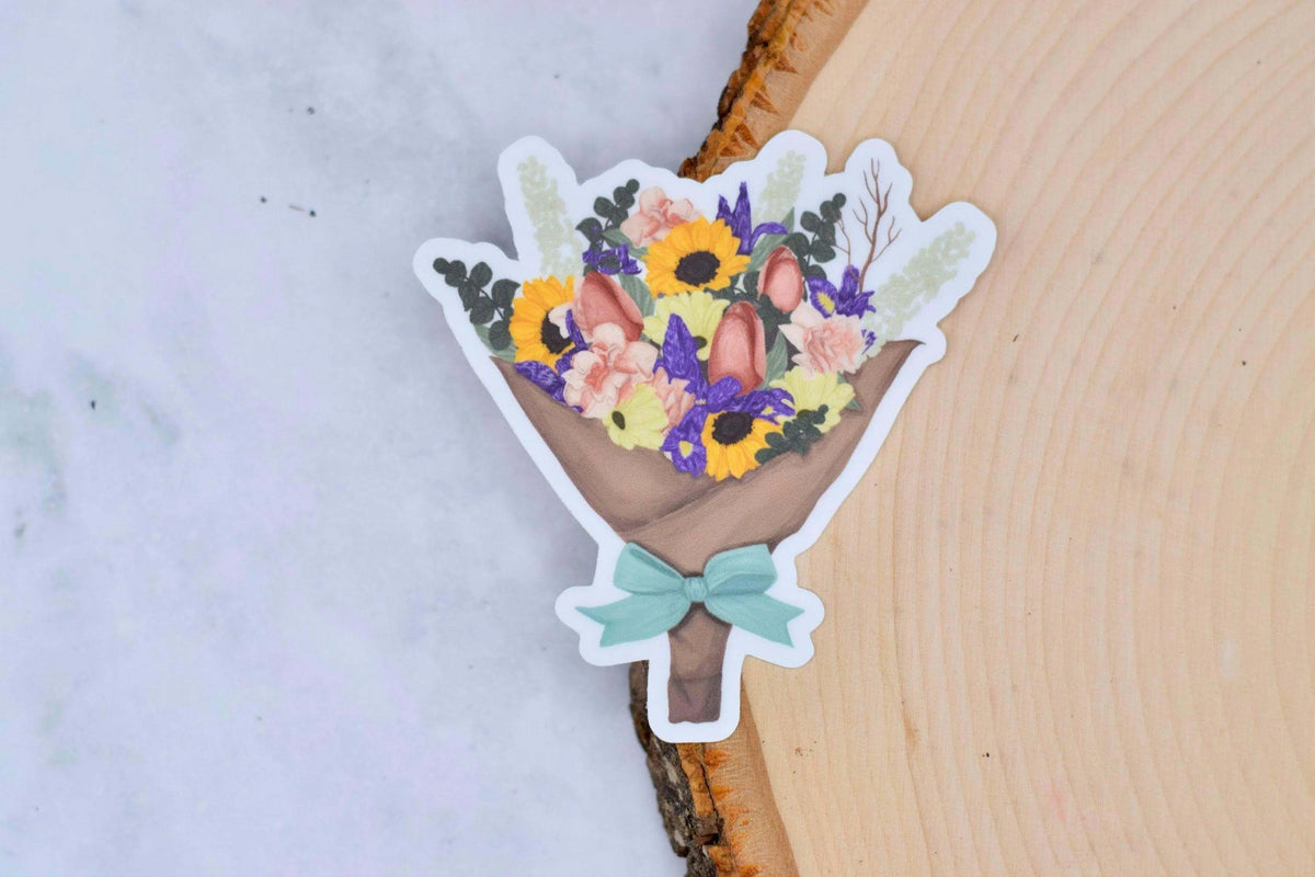 Colorful vinyl flower bouquet sticker by Winks Design Studio, LLC featuring vibrant floral designs on a clear background.