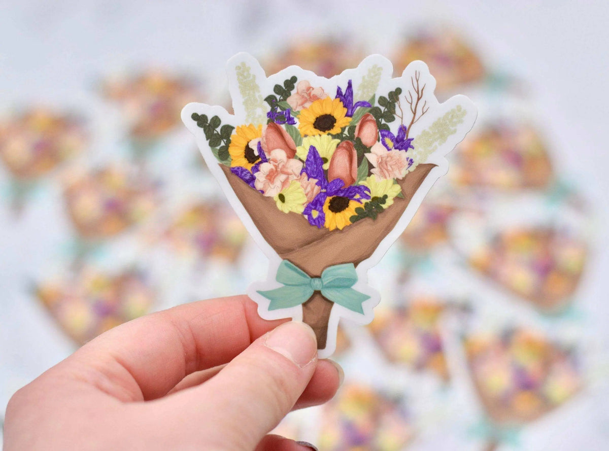 Vinyl flower bouquet sticker by Winks Design Studio, LLC featuring colorful floral design on a clear adhesive sheet.