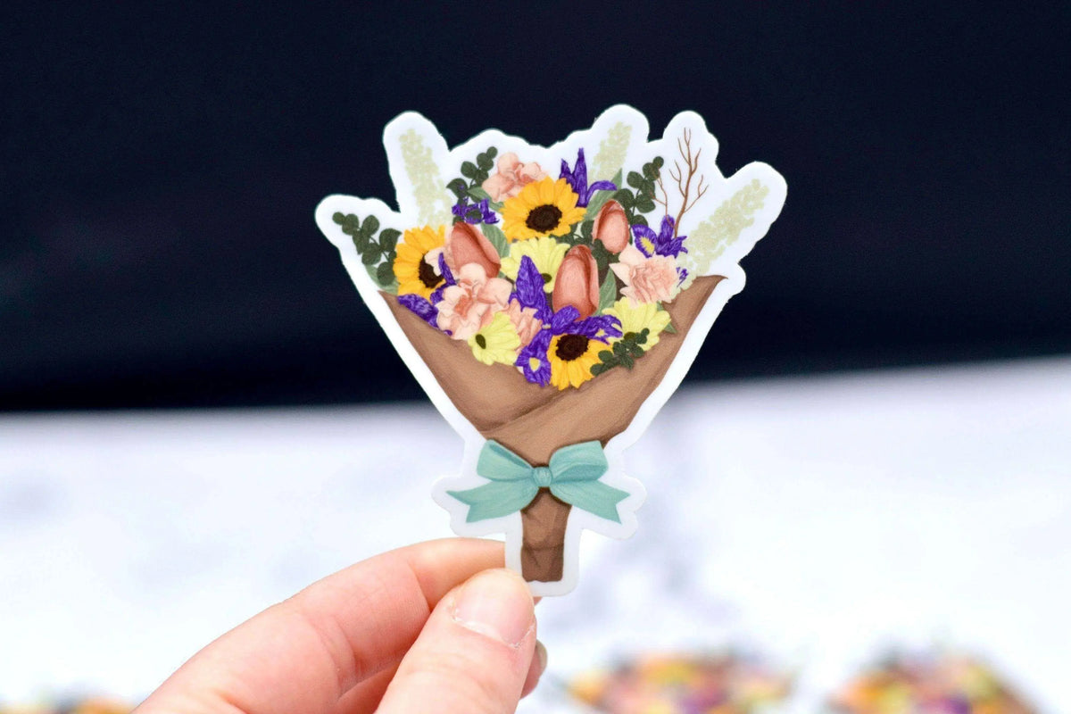 Colorful flower bouquet vinyl sticker by Winks Design Studio, LLC, featuring vibrant floral designs on a transparent background.