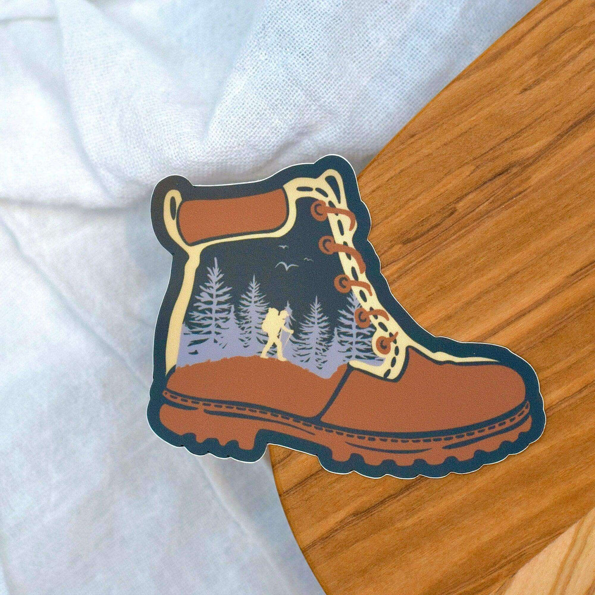Vinyl hiking boot sticker by Winks Design Studio, LLC featuring detailed illustration for outdoor gear decoration.