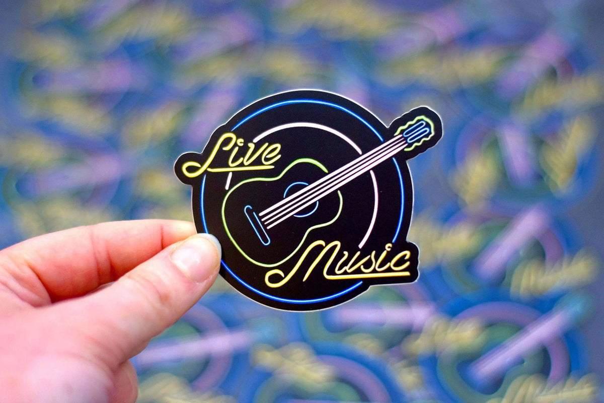 Waterproof vinyl sticker featuring a live music neon sign design, 3x2.5 inches, by Winks Design Studio, LLC.