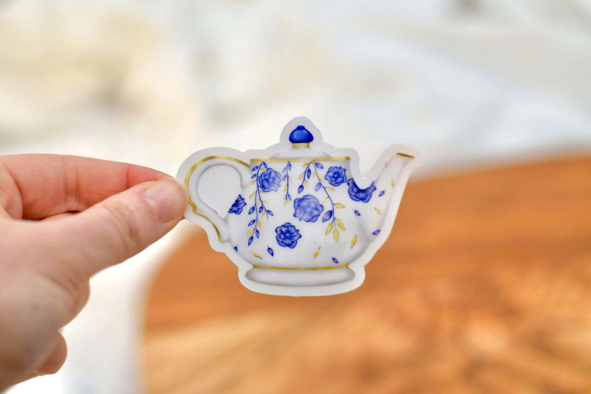Set of colorful vinyl tea party stickers from Winks Design Studio, LLC featuring teacups, teapots, and playful tea-themed designs.