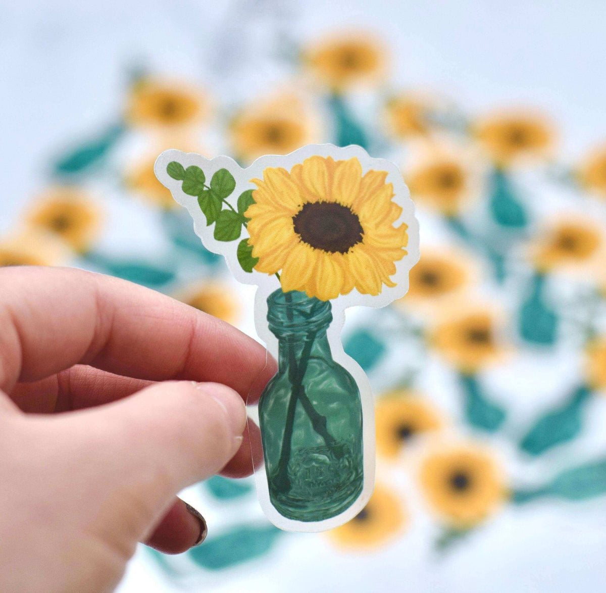 Clear vinyl sunflower sticker from Winks Design Studio LLC featuring a detailed sunflower design on transparent background.