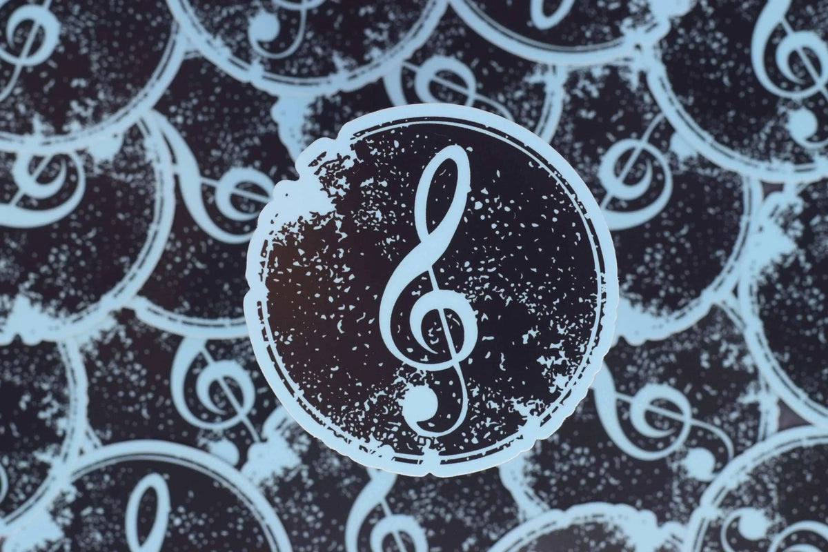 Treble clef music vinyl sticker by Winks Design Studio LLC, featuring a detailed treble clef symbol on a transparent background.