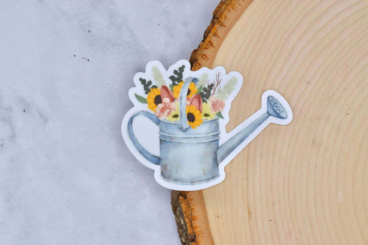 Vintage watering can vinyl sticker by Winks Design Studio, LLC, featuring a charming design for decorating notebooks and walls.