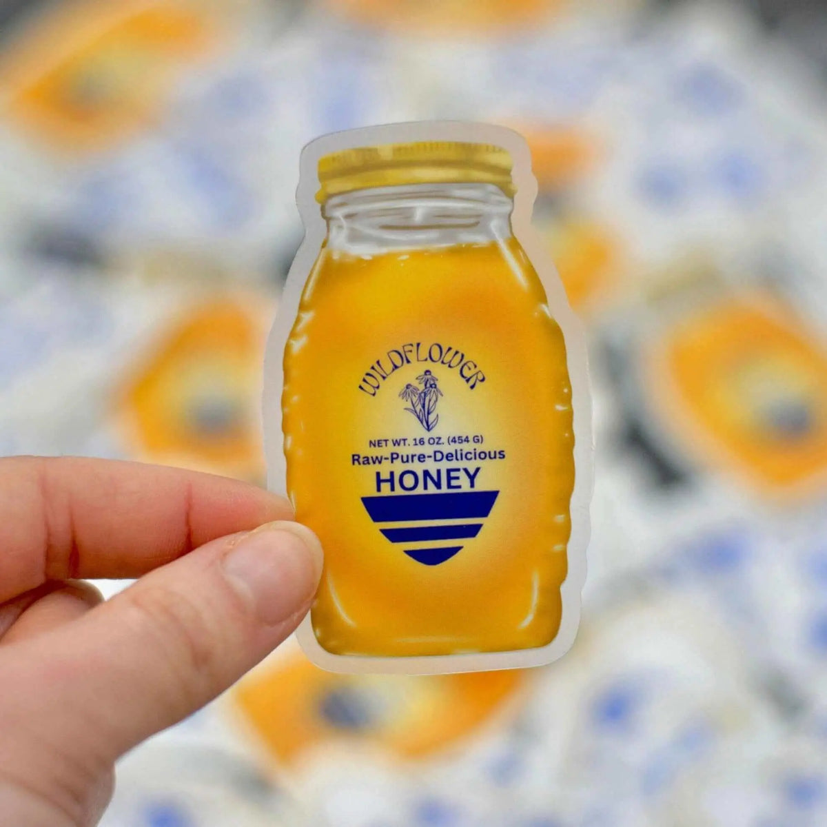 Wildflower Honey Jar vinyl sticker by Winks Design Studio, LLC featuring a detailed honey jar with floral wildflower designs