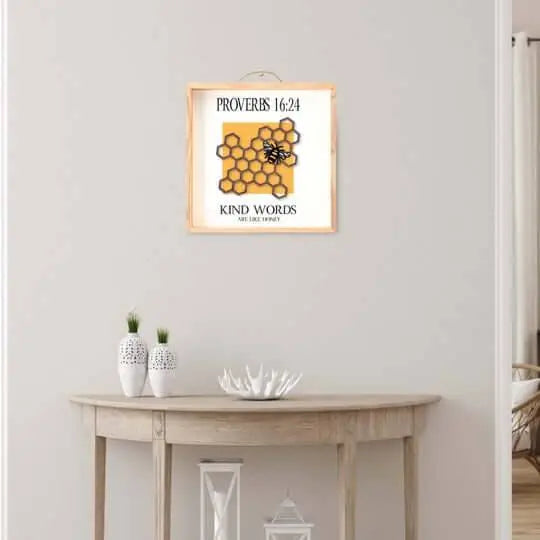 Wall art sign by Winks Design Studio featuring the quote "Kind Words Are Like Honey" in elegant lettering.