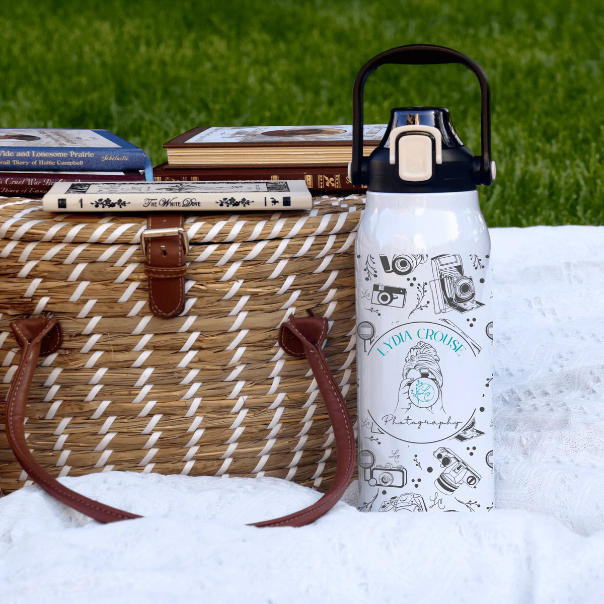 Winks Design Studio Lydia Crouse 57 oz water bottle with a sleek design, transparent body, and secure screw-on lid.