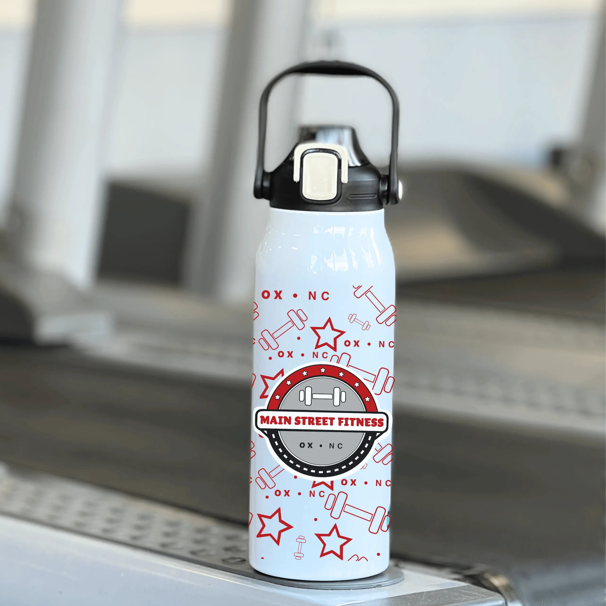 Main Street Fitness water bottle by Winks Design Studio, LLC, 57 oz reusable water bottle with a sleek design and spill-proof lid.
