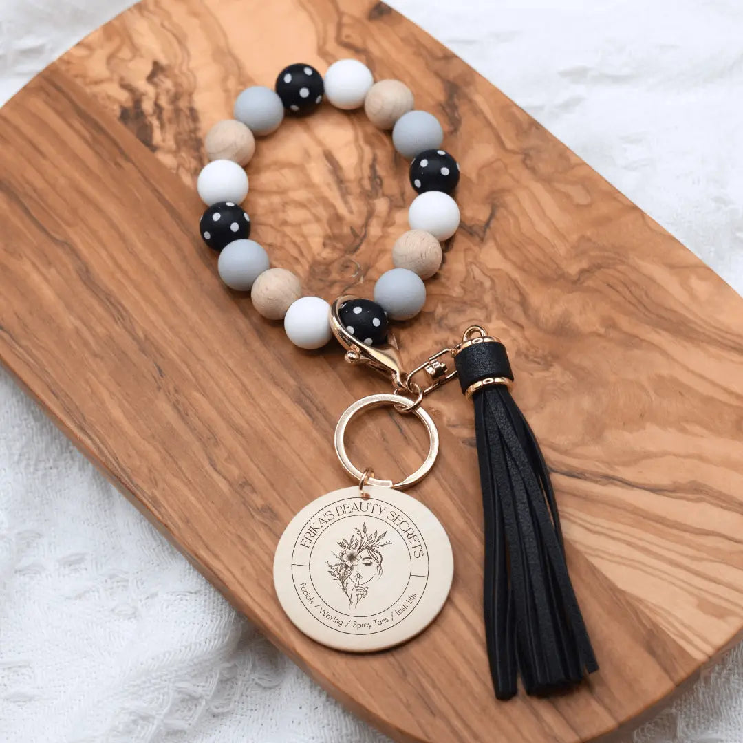 Black silicone wristlet keychain with polka dot design from Erika&