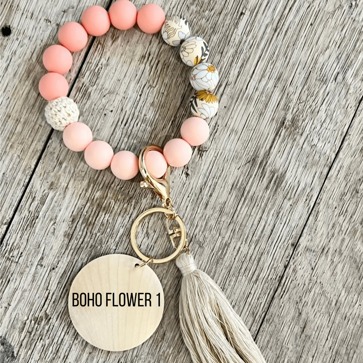 Pink botanical silicone wristlet keychain by Winks Design Studio, LLC, featuring a customizable design and durable strap.
