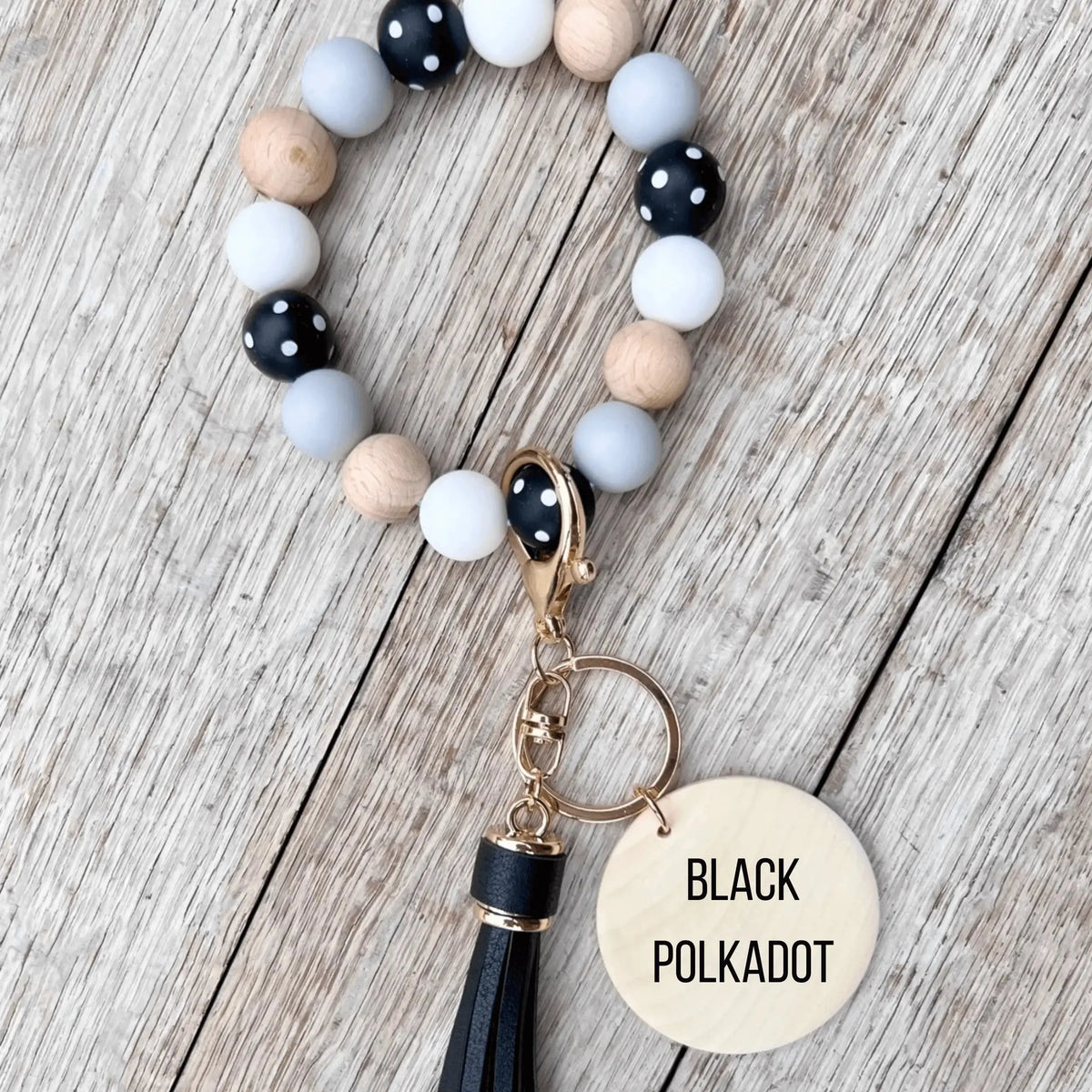 Pink botanical custom silicone wristlet keychain by Winks Design Studio, LLC featuring a durable and stylish design.